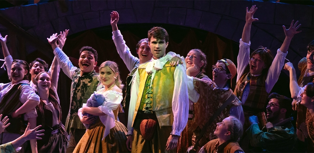 Group of actors on stage in period costume